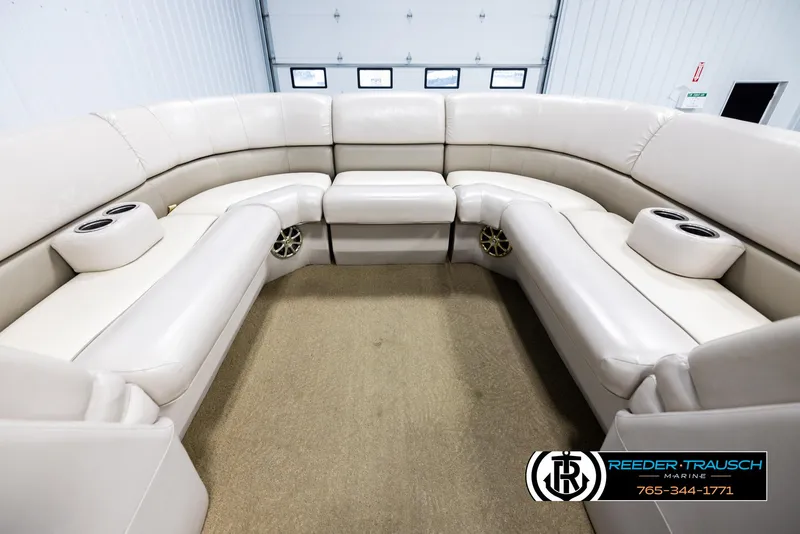 Slide: The Image of Luxurious seating area of a 2013 Bennington 2375 GCW pontoon boat with cup holders. - 18