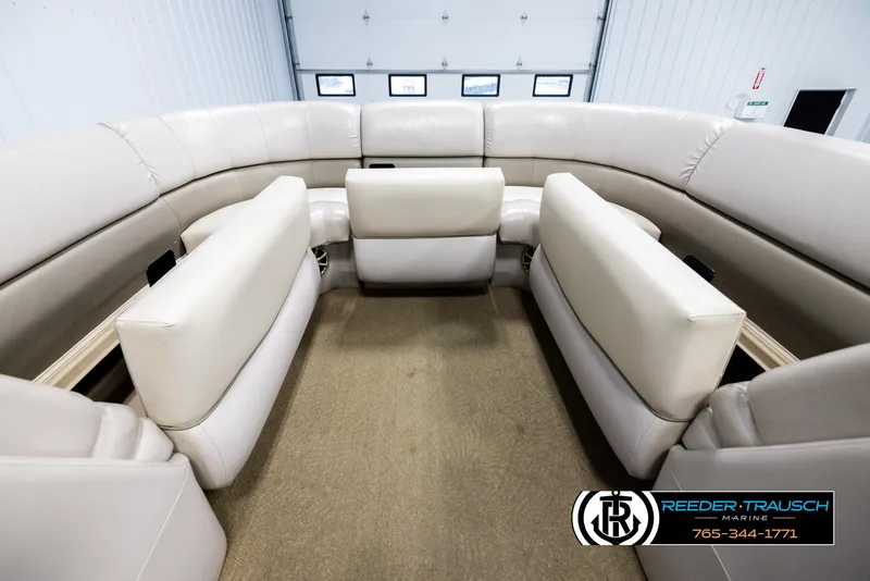 Slide: The Image of Luxurious seating on 2013 Bennington 2375 GCW pontoon boat in showroom. - 19