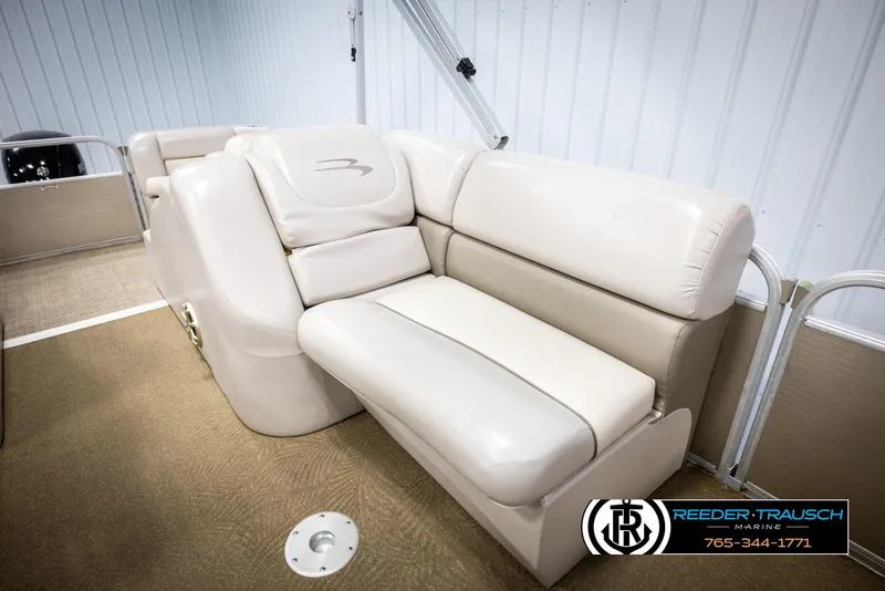 Slide: The Image of 2013 Bennington 2375 GCW boat interior with beige seating and carpeted flooring. - 26
