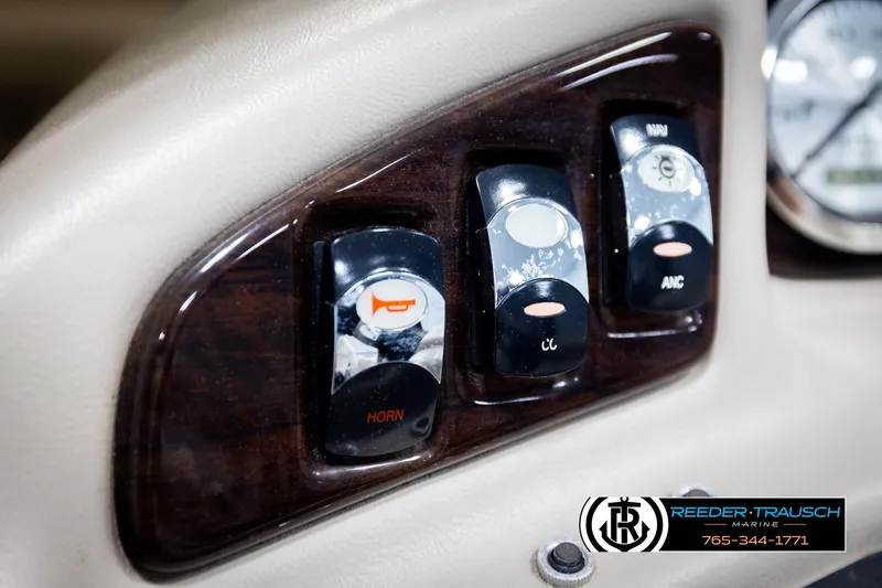 Slide: The Image of Control panel of a 2013 Bennington 2375 GCW boat with horn and navigation switches. - 33