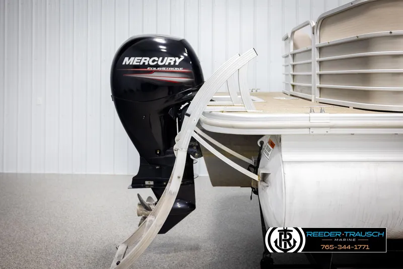Slide: The Image of 2013 Bennington 2375 GCW pontoon boat with Mercury FourStroke engine, displayed indoors. - 44