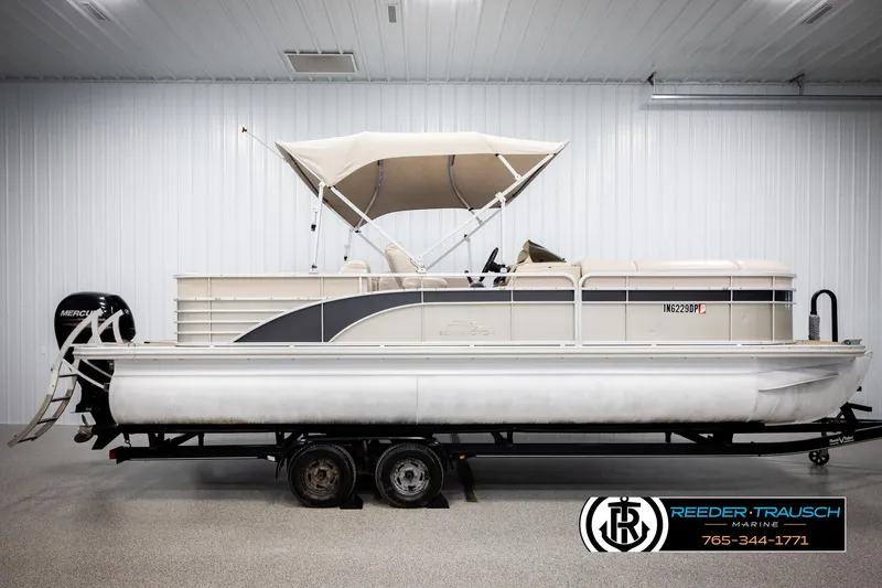 Slide: The Image of 2013 Bennington 2375 GCW pontoon boat on trailer in indoor showroom. - 5