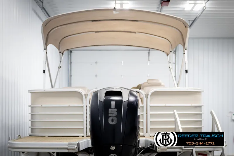 Slide: The Image of 2013 Bennington 2375 GCW pontoon boat with Mercury 150 engine in a showroom. - 7