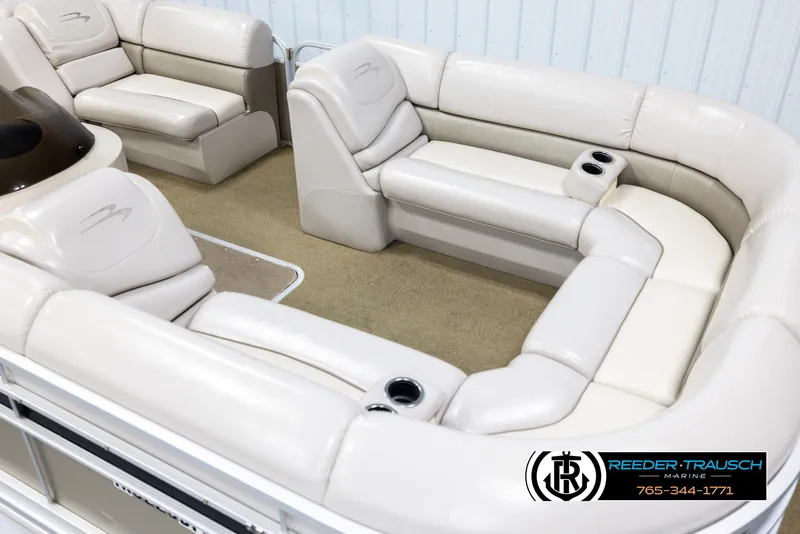 Slide: The Image of Luxurious seating on a 2013 Bennington 2375 GCW pontoon boat with beige upholstery. - 9