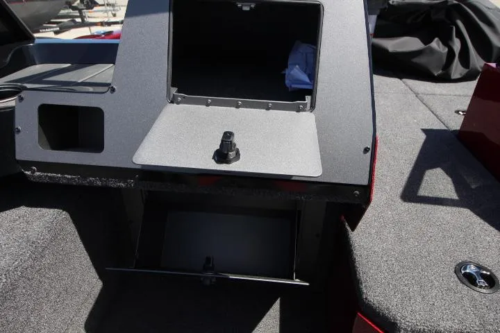 Slide: The Image of 2025 Vexus ADX180LS boat interior storage compartments and seating area. - 12