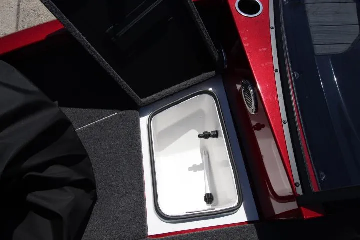 Slide: The Image of 2025 Vexus ADX180LS boat interior with open storage compartment and red detailing. - 13