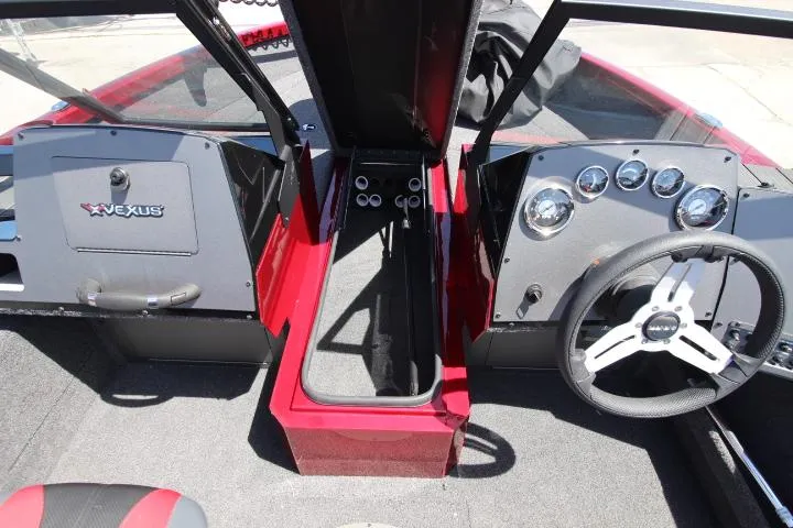 Slide: The Image of Interior view of 2025 Vexus ADX180LS boat dashboard with steering wheel and controls. - 5