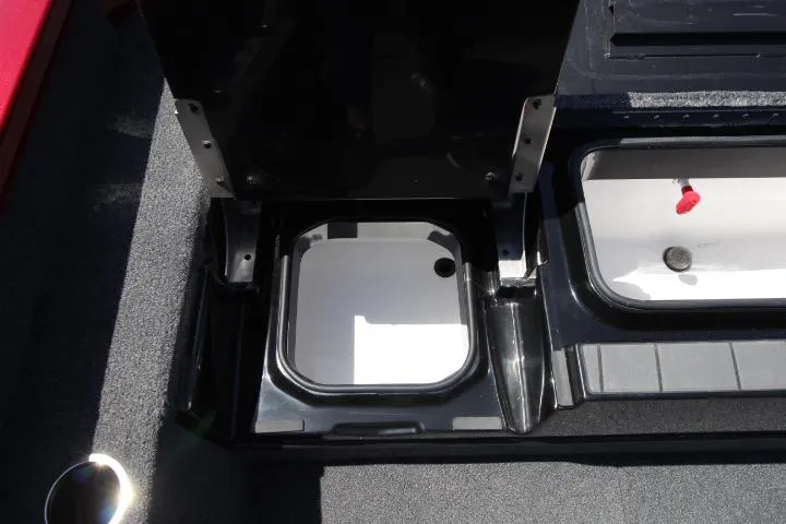 Slide: The Image of 2025 Vexus ADX180LS boat storage compartments with open lids. - 8