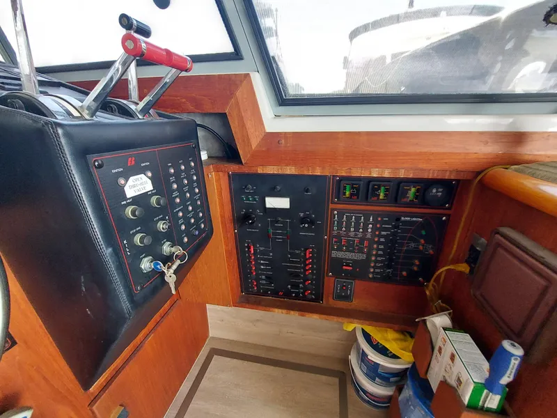 Slide: The Image of Control panel of a 1987 Bayliner 3870 Motoryacht with various switches and gauges. - 4