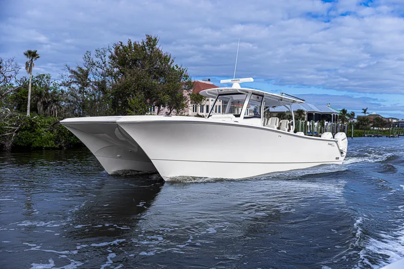 Slide: The Image of 2026 Front Runner 43 Catamaran cruising on a scenic waterway under a partly cloudy sky. - 3