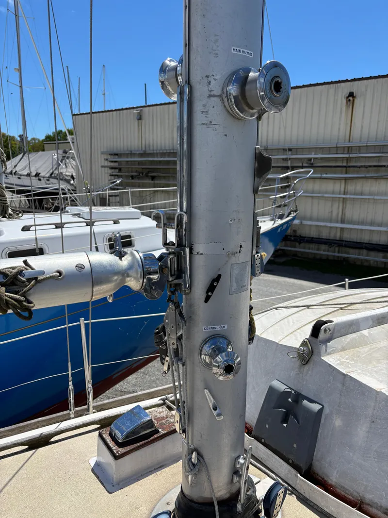 Slide: The Image of Mast of a 1972 Tartan 34C sailboat in a marina setting. - 14
