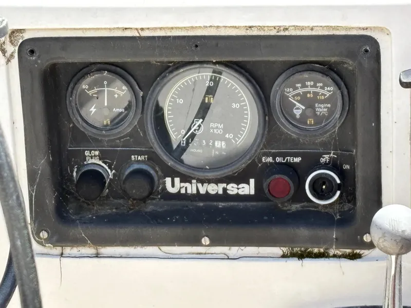 Slide: The Image of Instrument panel of a 1972 Tartan 34C sailboat with Universal engine gauges. - 22