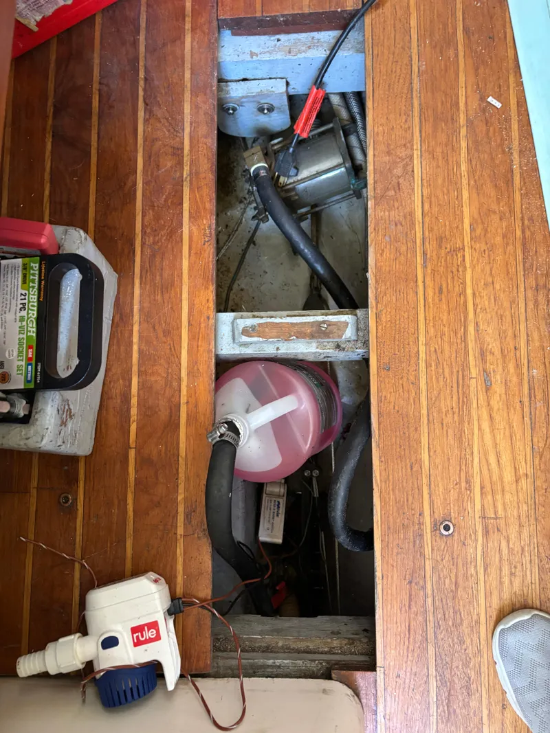 Slide: The Image of Interior view of a 1972 Tartan 34C sailboat showing bilge area and equipment. - 38