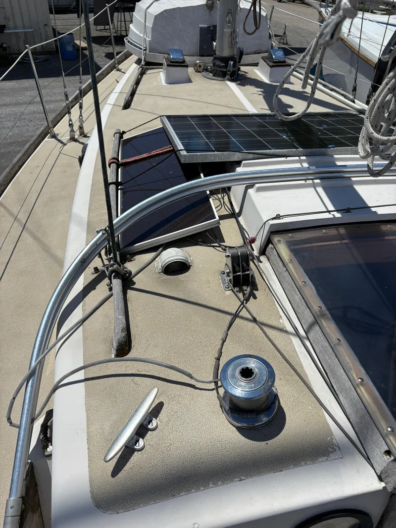 Slide: The Image of 1972 Tartan 34C sailboat deck with solar panels and winch. - 5