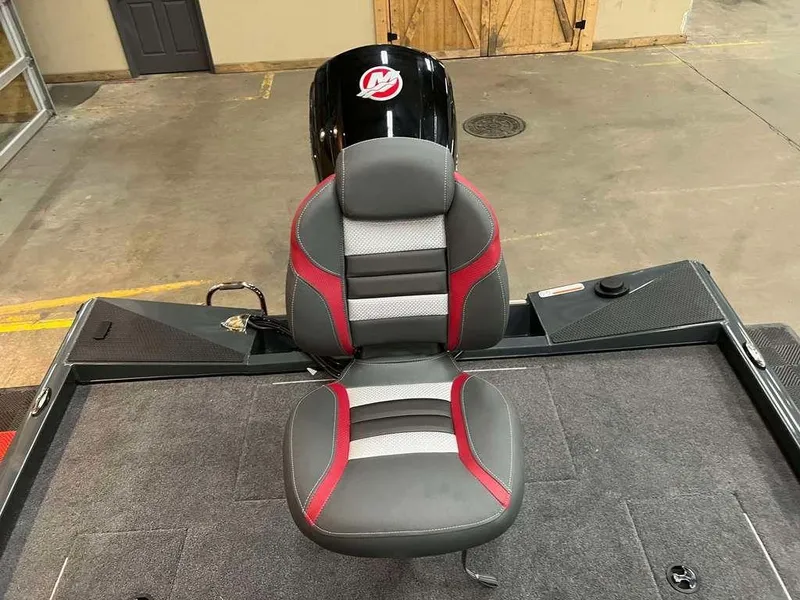 Slide: The Image of 2025 Ranger RT188C boat seat with red and gray accents in a showroom. - 8
