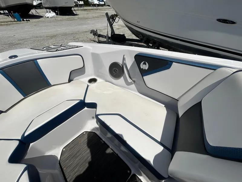 Slide: The Image of 2019 Scarab 215 ID boat interior with white and blue seating. - 10