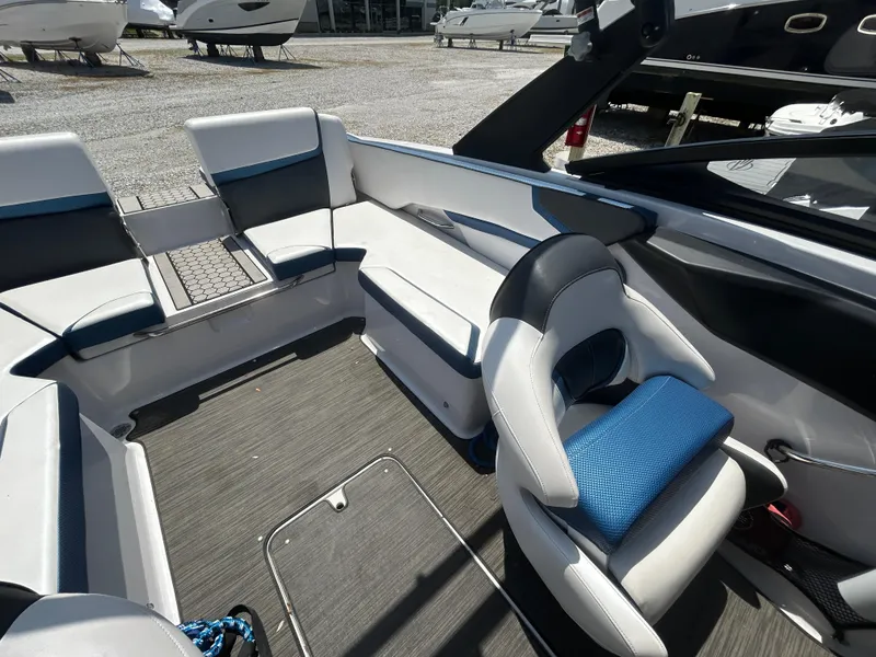 Slide: The Image of Interior of 2019 Scarab 215 ID boat with modern seating and sleek design. - 6