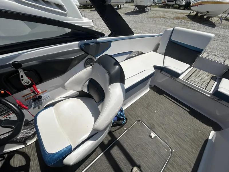 Slide: The Image of 2019 Scarab 215 ID boat interior with seating and steering wheel. - 7
