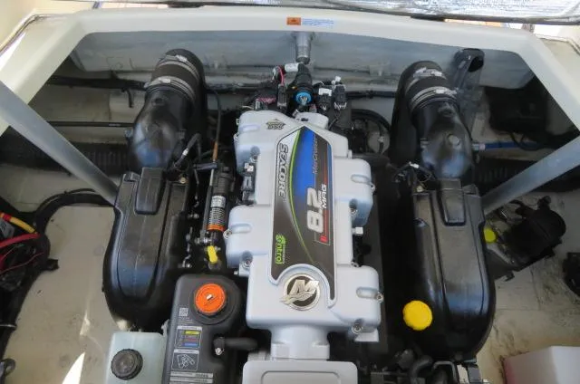 Slide: The Image of Engine compartment of a 2021 Chris-Craft Launch 27 boat, featuring a powerful 8.2L engine. - 11