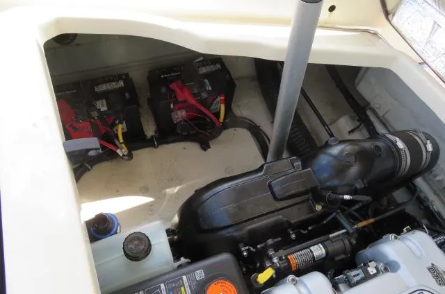 Slide: The Image of Engine compartment of 2021 Chris-Craft Launch 27, showing batteries and engine components. - 12