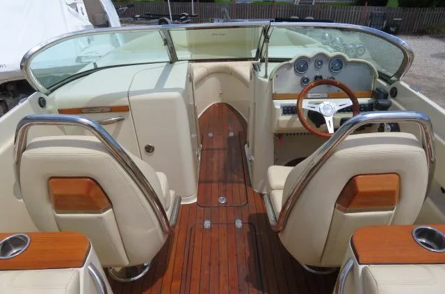 Slide: The Image of 2021 Chris-Craft Launch 27 interior with wood accents and leather seating. - 25