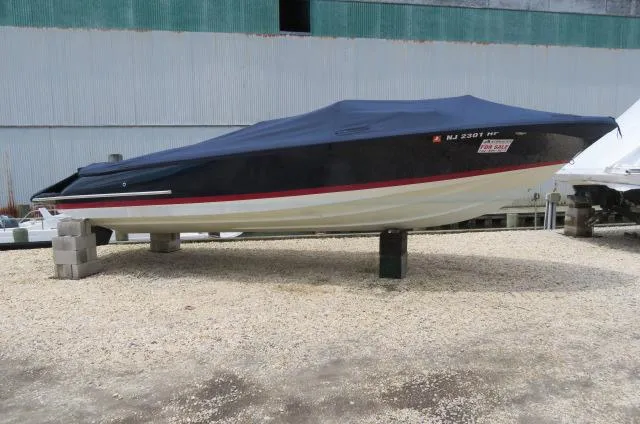 Slide: The Image of 2021 Chris-Craft Launch 27 boat covered and elevated on stands. - 3