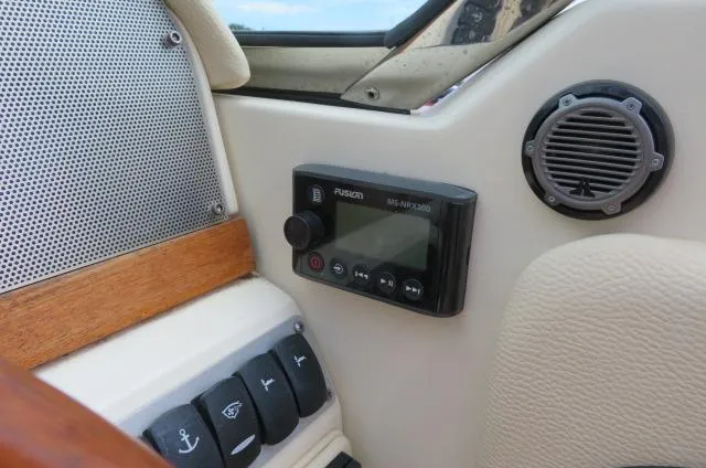 Slide: The Image of 2021 Chris-Craft Launch 27 dashboard with Fusion MS-RA205 stereo and control panel. - 30