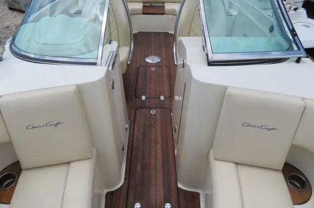 Slide: The Image of 2021 Chris-Craft Launch 27 boat interior with teak flooring and cream leather seats. - 35