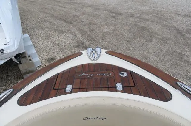 Slide: The Image of 2021 Chris-Craft Launch 27 boat with wooden deck detail. - 37