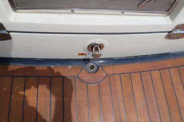 Slide: The Image of 2021 Chris-Craft Launch 27 boat deck with wood finish and metal fittings. - 6