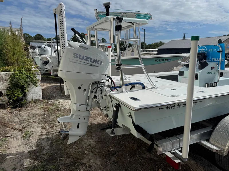 Slide: The Image of 2023 Mitzi Skiffs 17 Tournament boat with Suzuki outboard motor on trailer. - 3