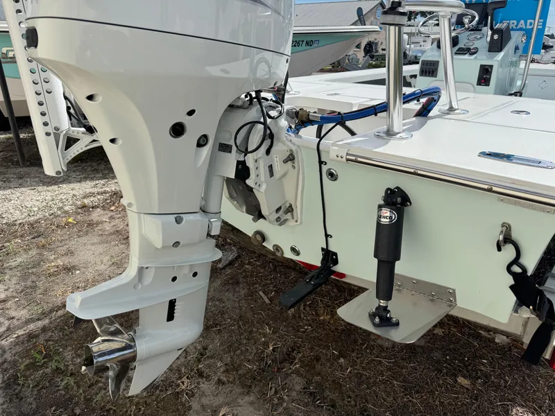 Slide: The Image of 2023 Mitzi Skiffs 17 Tournament boat with outboard motor and trim tab. - 4