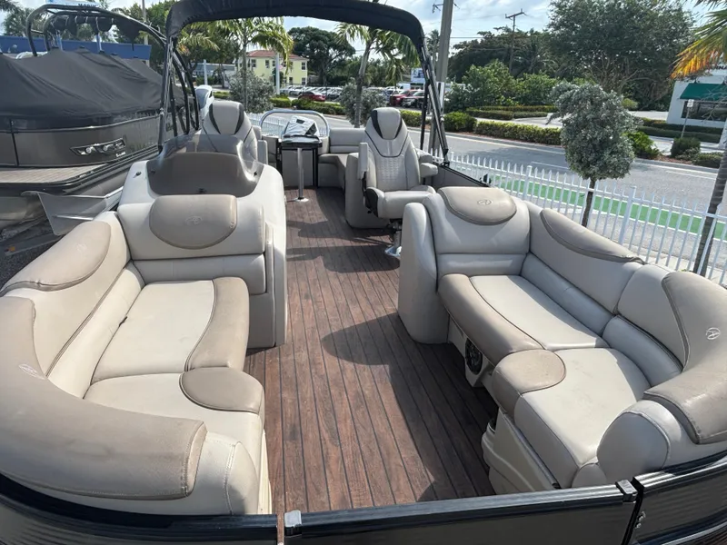 Slide: The Image of 2018 Avalon Catalina Platinum Quad Lounge boat with spacious seating and elegant interior design. - 2