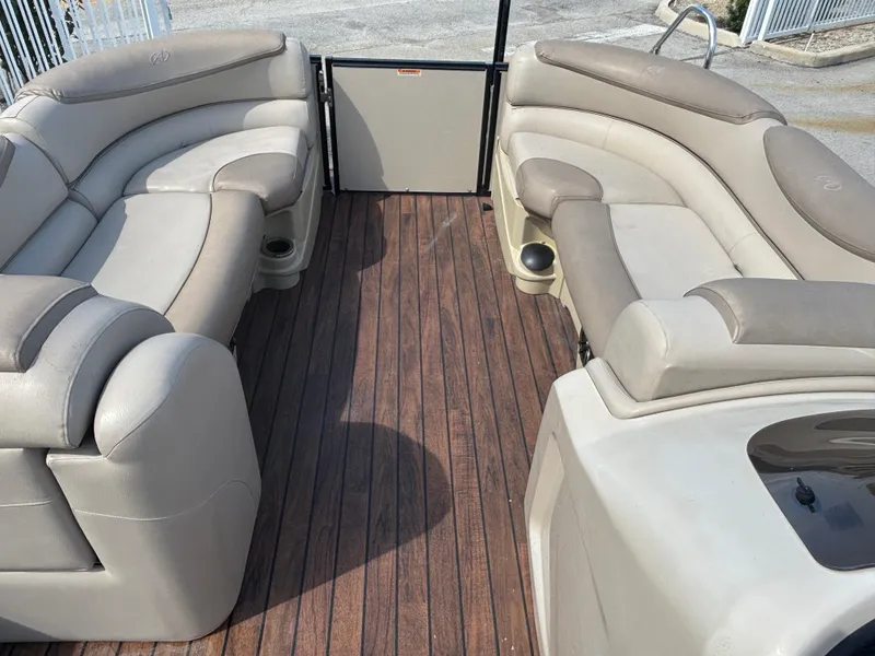 Slide: The Image of 2018 Avalon Catalina Platinum Quad Lounge interior with plush seating and wood-style flooring. - 3