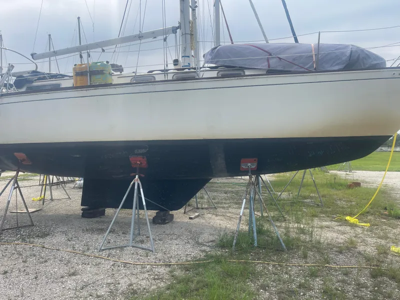Slide: The Image of 1983 Sabre 38 Mk I Swing Keel sailboat on stands, side view. - 6