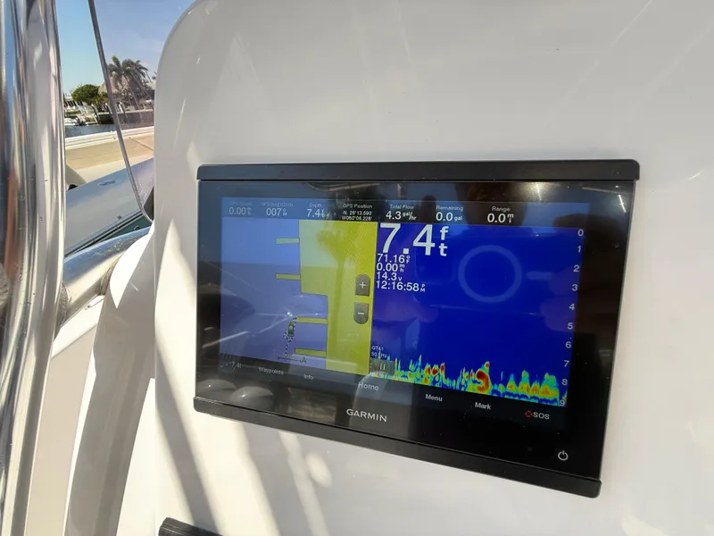 Slide: The Image of Garmin fishfinder display on 2019 Pro-Line 23 Sport boat, showing depth and sonar data. - 27