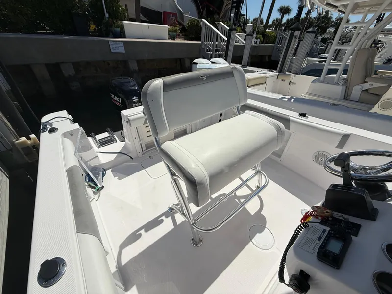 Slide: The Image of 2019 Pro-Line 23 Sport boat interior with seating and control panel. - 28