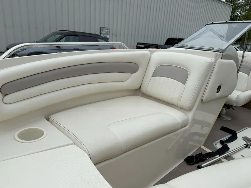 Slide: The Image of 2003 Stingray 200LX boat interior with white and gray seating. - 17