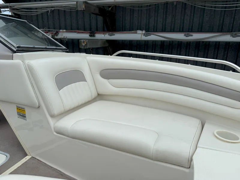 Slide: The Image of 2003 Stingray 200LX boat interior with white and gray seating. - 18