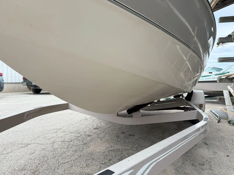 Slide: The Image of 2003 Stingray 200LX boat on trailer, viewed from below, showcasing hull design. - 3
