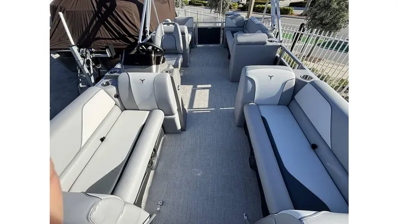 Slide: The Image of 2025 Tahoe Pontoon 19 Quad Lounge Sport with spacious seating and modern design. - 2