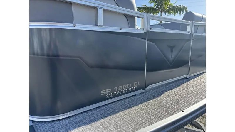 Slide: The Image of 2025 Tahoe Pontoon 19 Quad Lounge Sport, Saltwater Series, side view. - 6