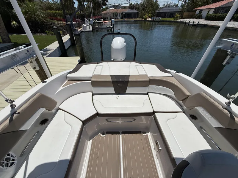 Slide: The Image of 2021 Chaparral 23 SSi OB boat interior with spacious seating and elegant design. - 15