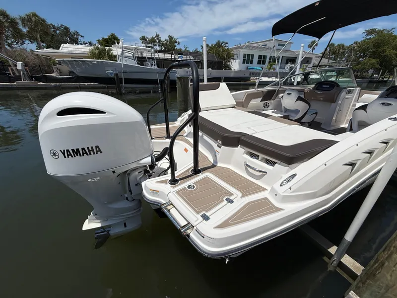 Slide: The Image of 2021 Chaparral 23 SSi OB boat with Yamaha outboard engine docked in marina. - 18