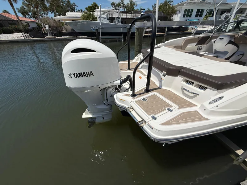 Slide: The Image of 2021 Chaparral 23 SSi OB boat with Yamaha outboard motor in a marina. - 8