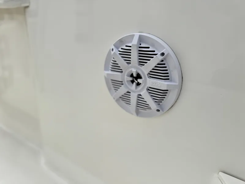 Slide: The Image of 2022 Bayliner Trophy T22CC boat speaker detail on white surface. - 18