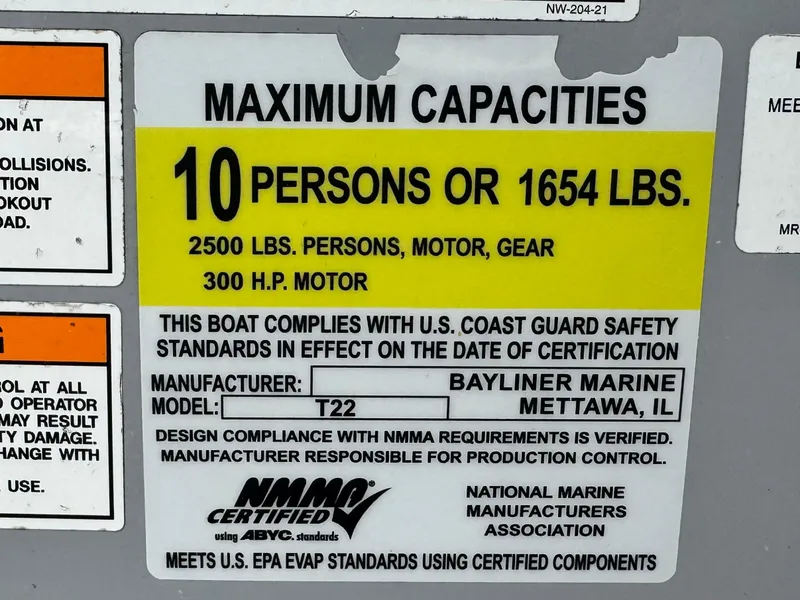 Slide: The Image of Bayliner Trophy T22CC 2022 capacity label: 10 persons or 1654 lbs, 300 HP motor. - 29