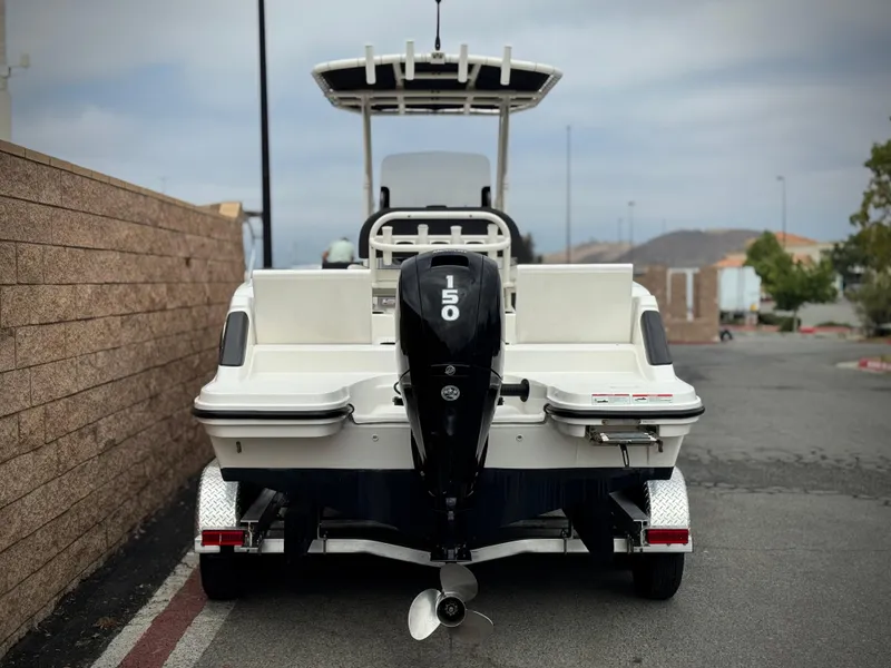 Slide: The Image of 2022 Bayliner Trophy T22CC boat with 150 HP engine on trailer. - 4