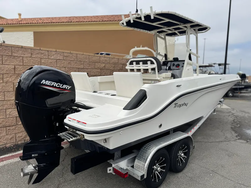 Slide: The Image of 2022 Bayliner Trophy T22CC boat on trailer with Mercury outboard engine. - 5