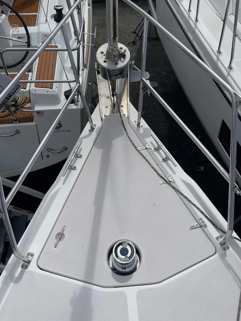 Slide: The Image of Bow of a 2004 Catalina 350 sailboat with stainless steel railings. - 6